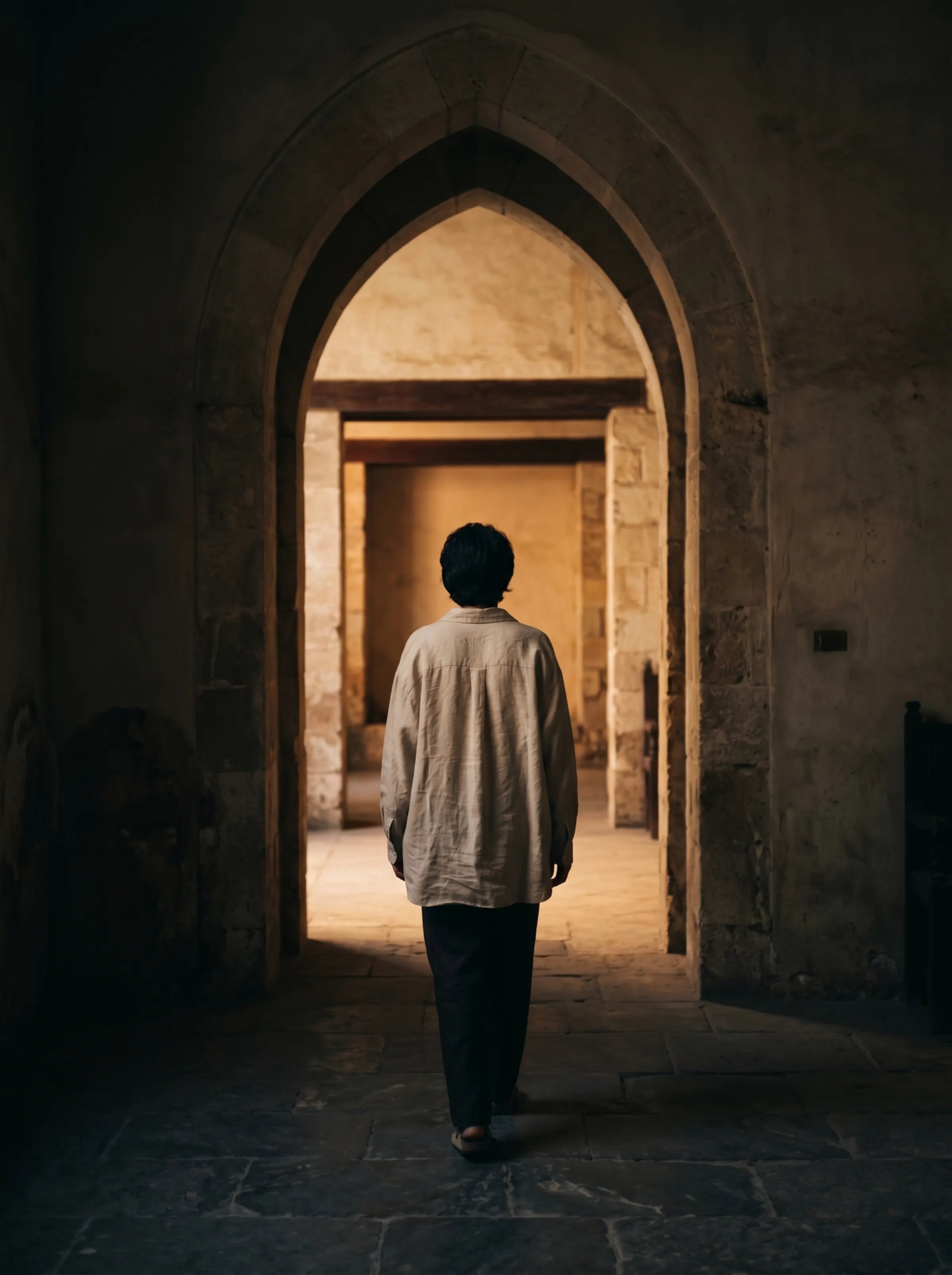 Figure from behind, leaving a doorway