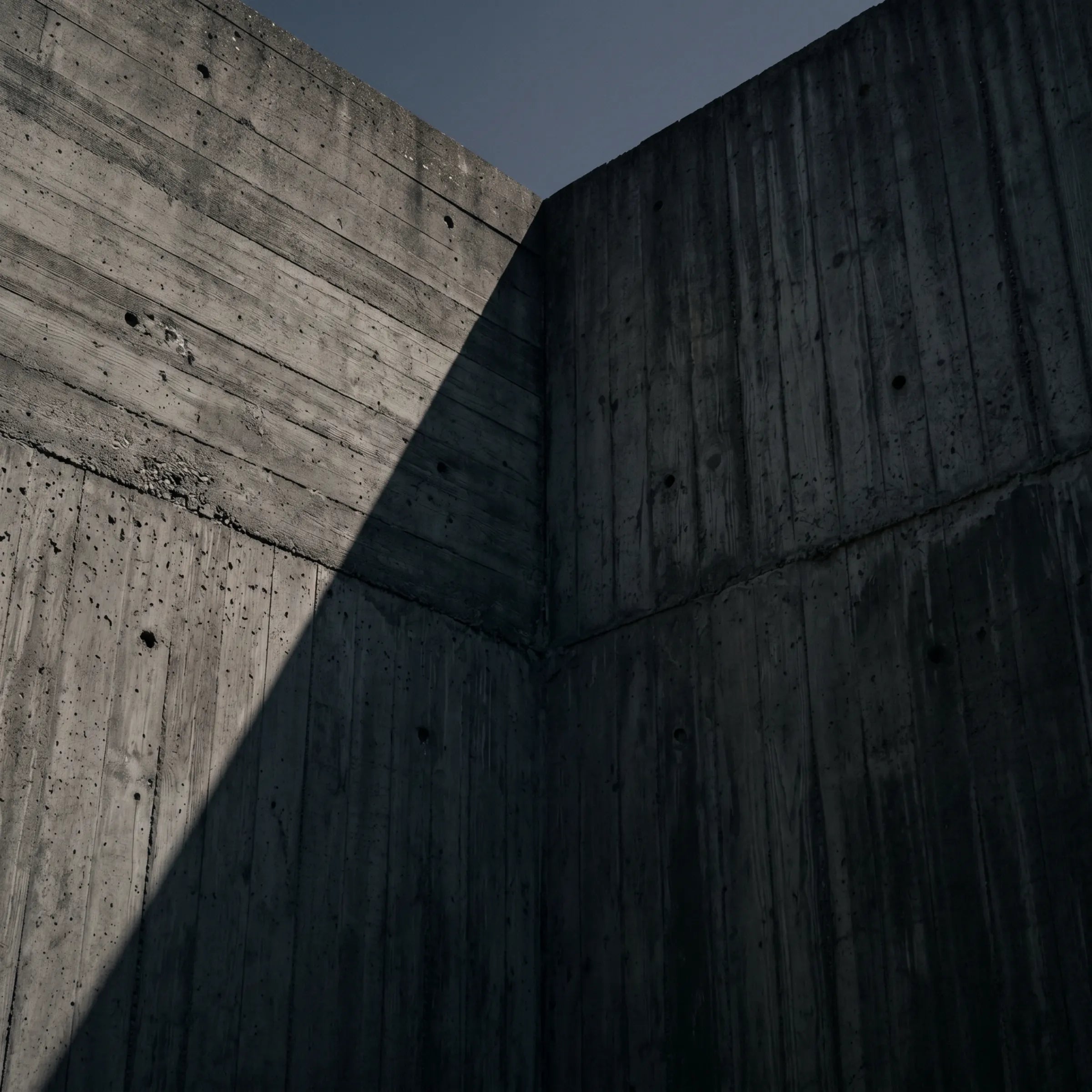 Brutalist concrete corner in low light